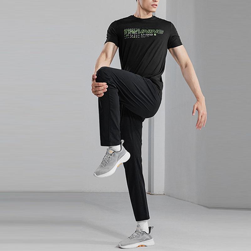 Li-Ning Rychleschnoucí jednobarevné pletené sportovní kalhoty s logem Pánské spodky Černé AYKS477-1