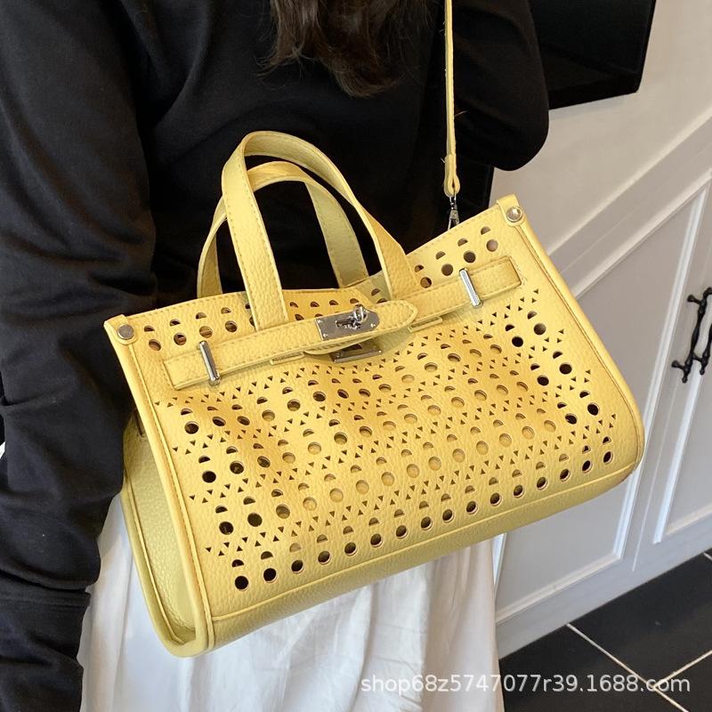 High-end cut-out handheld tote bag for women 2025 new fashion design large-capacity commuter mother-in-law bag crossbody bag
