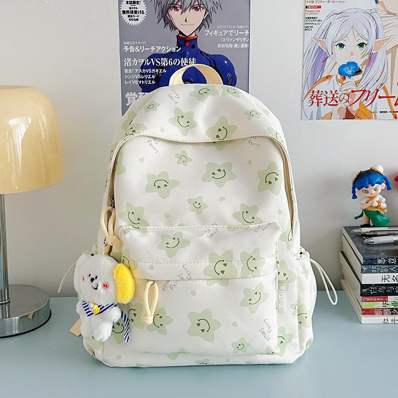 Nowy tornister jest wysokiej jakości, świeży, słodki i uroczy, a plecak w gwiazdki to lekki plecak podróżny dla uczniów gimnazjum.