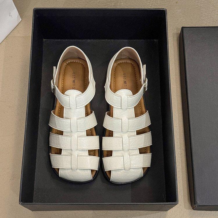 

Ретро плетеные сандалии баотоу женские лето 2025 новая мода полые туфли-клетка для свиньи на плоской подошве с мягкой подошвой повседневные римские туфли 40