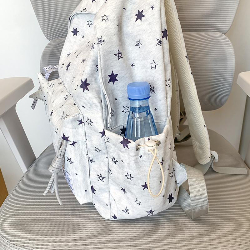 Star-Printed Backpack with Front Zipper Pocket and Tassel Details for School and Daily Use