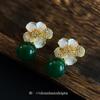 Emerald flower ear clips without holes, high-end niche design studs, French light luxury temperament earrings, earrings.