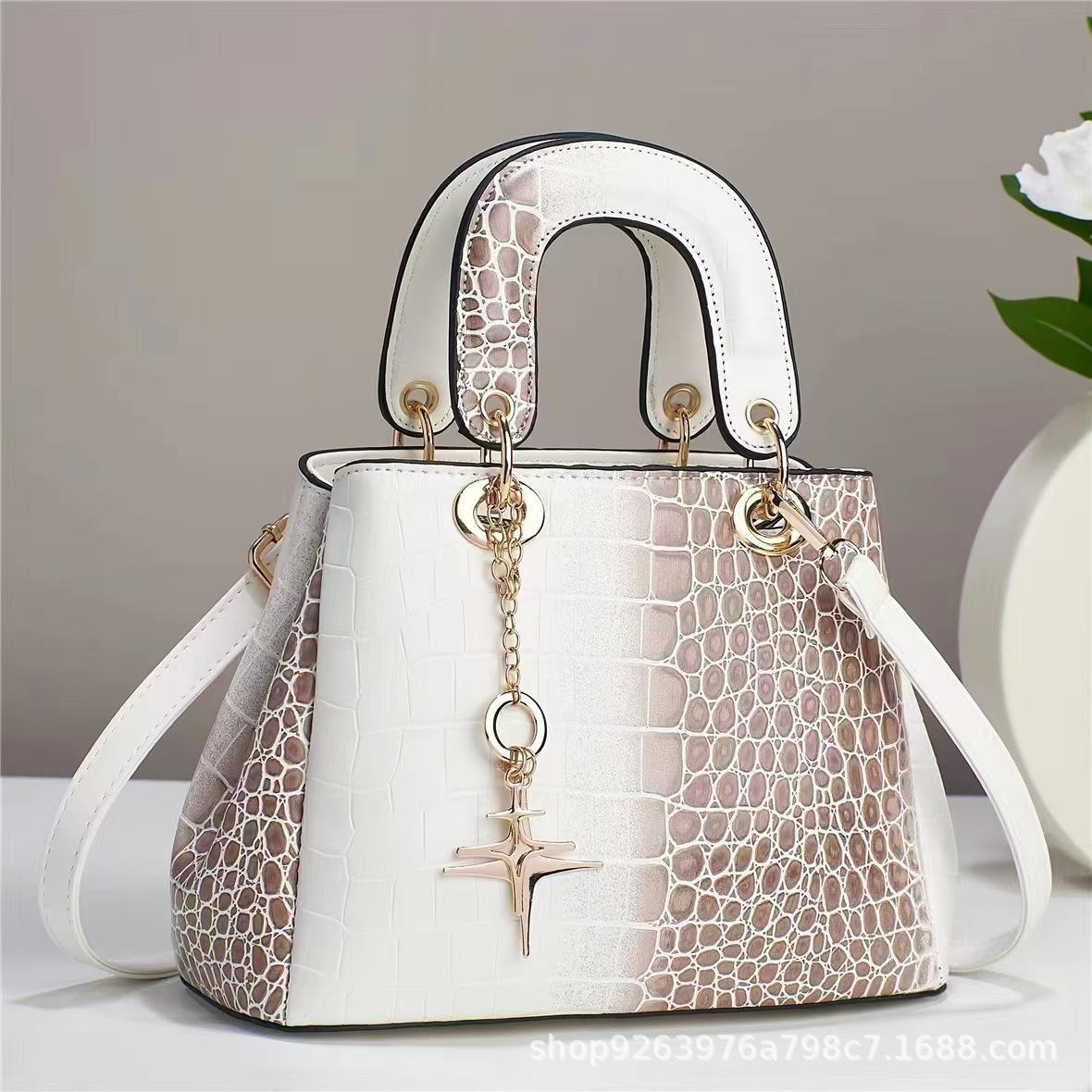 

New Serpentine Large Capacity Handbag Texture Foreign Style Bright Leather High Quality Single Shoulder Oblique Span Quality Bag Large Bag .