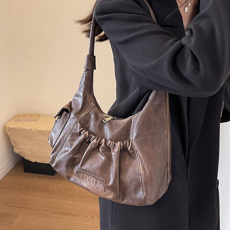 Niche high-end sense retro Spice Girl underarm bag women 2025 new Maillard style shoulder bag pleated dumpling bag