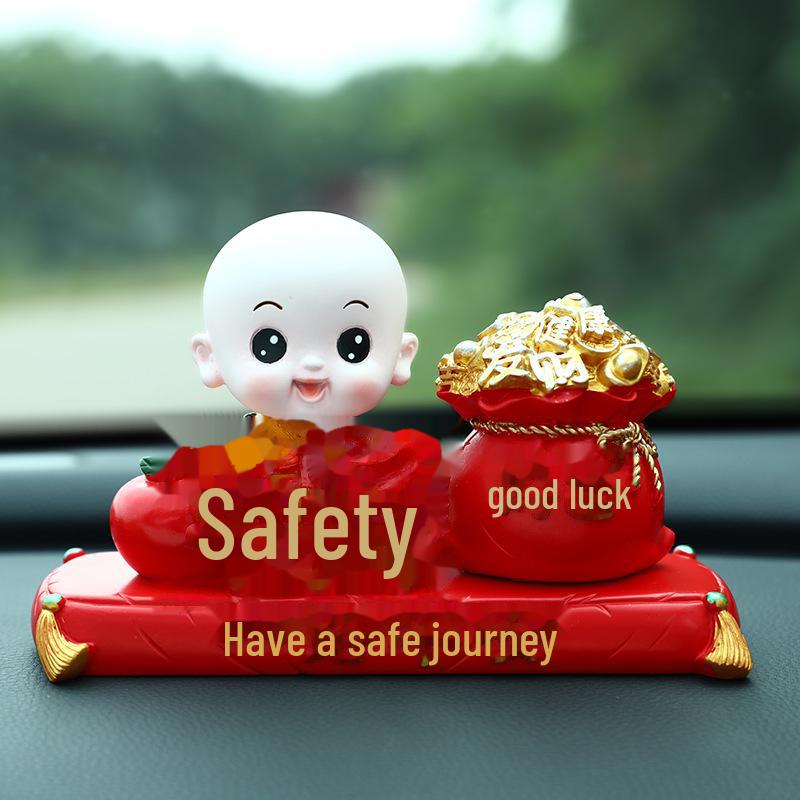 Creative Little Monk Maitreya Buddha Car Ornament: Cute, Shaking Head Resin Doll for Car Interior Decoration and Safety.