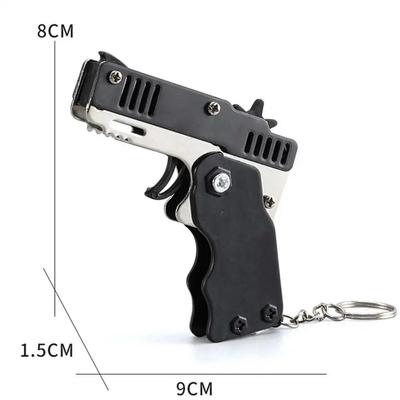 1PC Mini Keychain Pistole Gumička Pistole Hračka Pistole Střelba Pistole Slitina Dětské Venkovní aktivity Společenská hra Narozeninový dárek pro děti