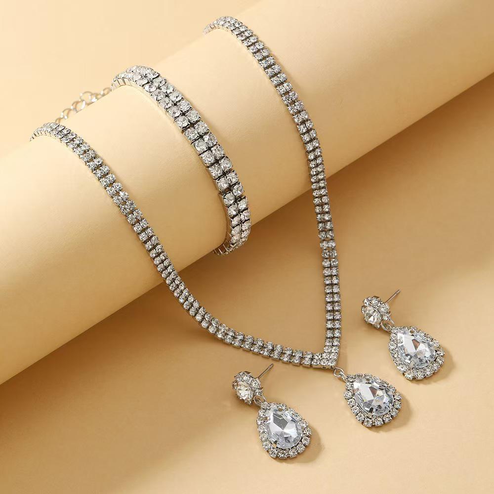 Women's Sparkling Diamond Jewelry Set: Crystal Drop Necklace, Earrings, and Bracelet Trio