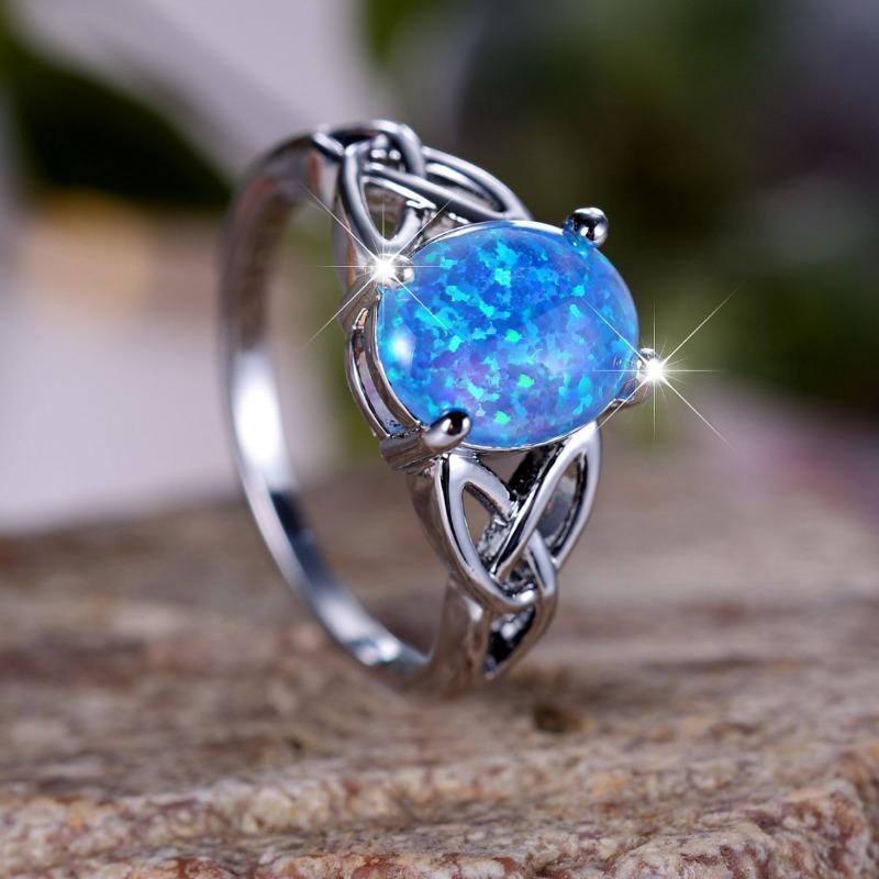 Fashionable Commuting Egg Shaped Blue Border Cross Ring