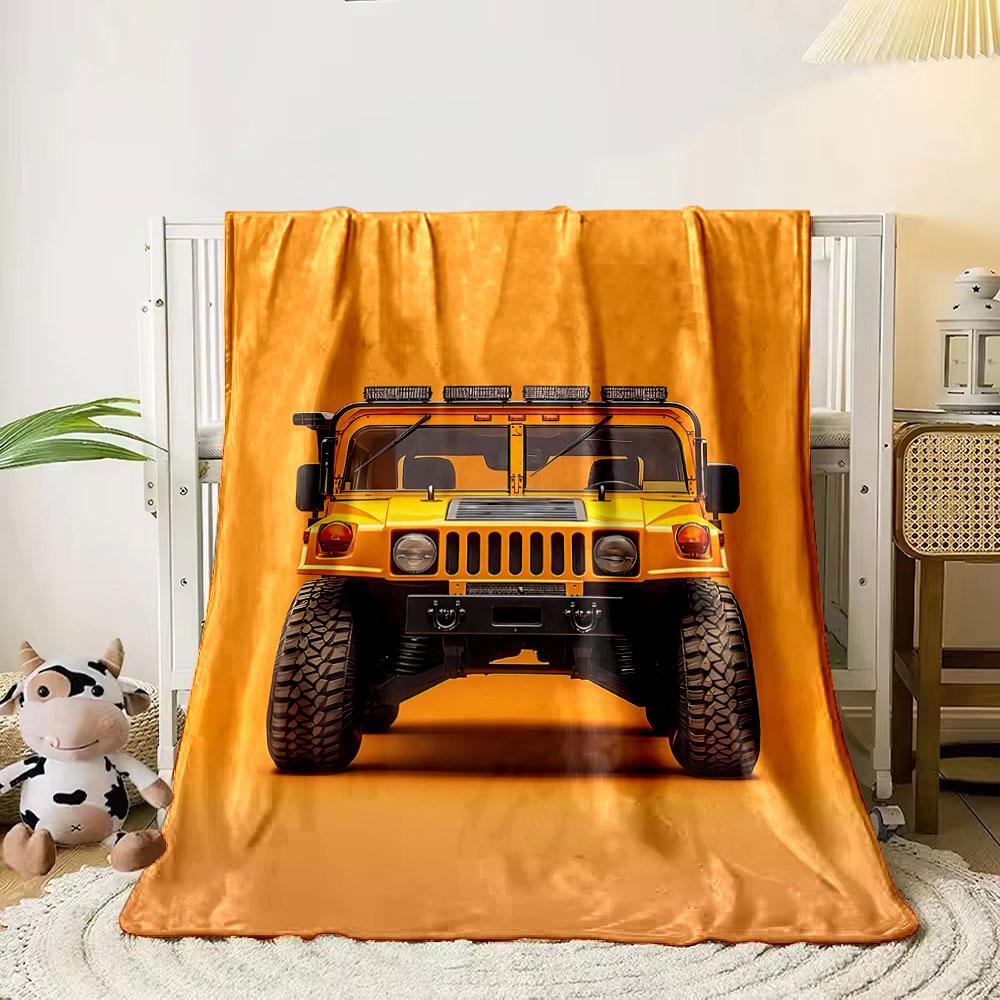 Front view of a bright yellow rugged vehicle against an orange background. for all seasons blanket lunch break throw gift