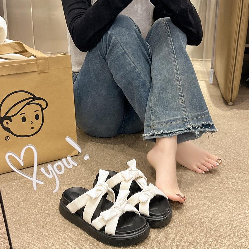 Bow-tie one-word cool slippers women's 2025 summer new Korean version of cute students thick-soled open-toed women's slippers