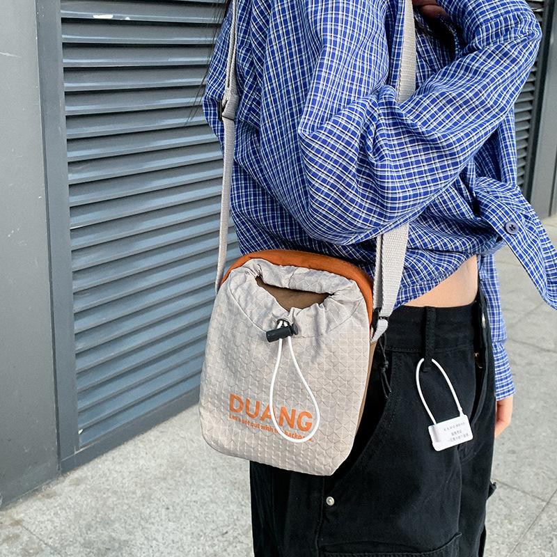 

Workpiece locomotive ins letter drawstring shoulder bag street style daily commuting men s and women s one-shoulder crossbody bag серый