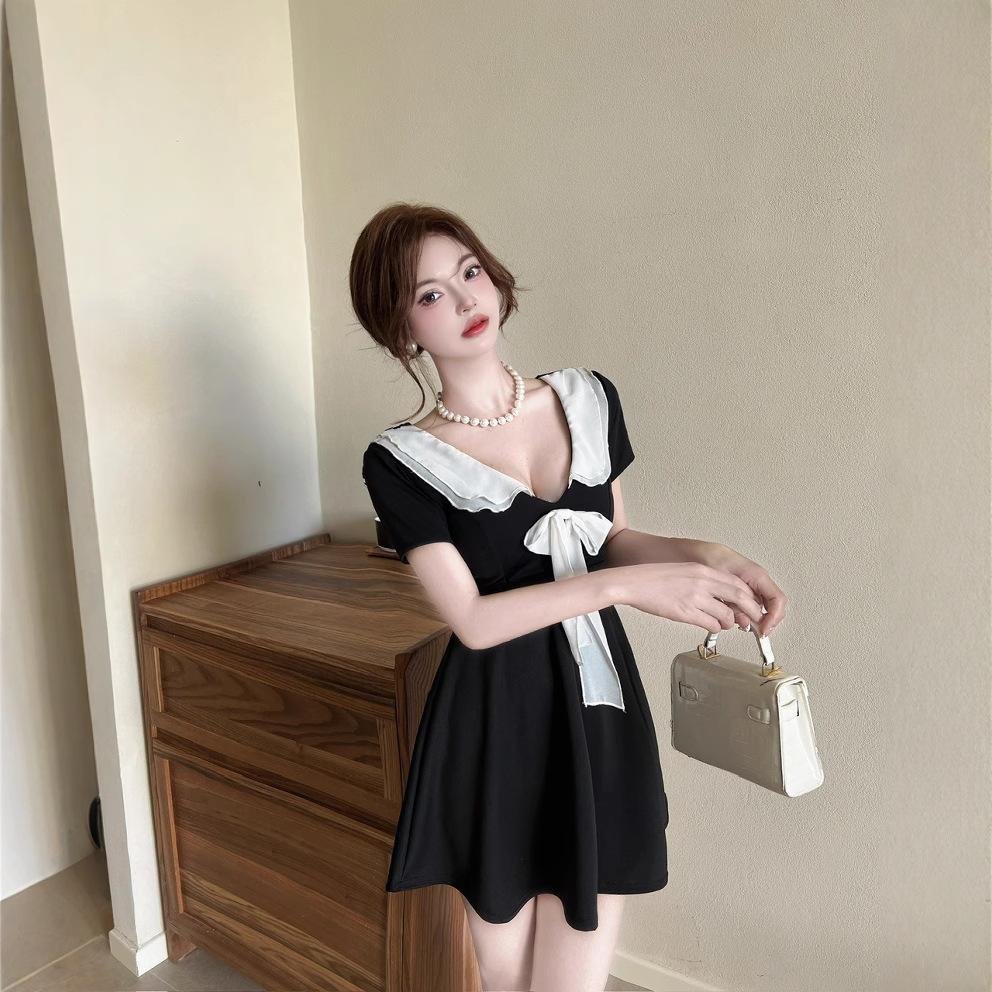 Sexy lapel short-sleeved bow splicing small man covering meat pure desire wind sweet waist big swing dress