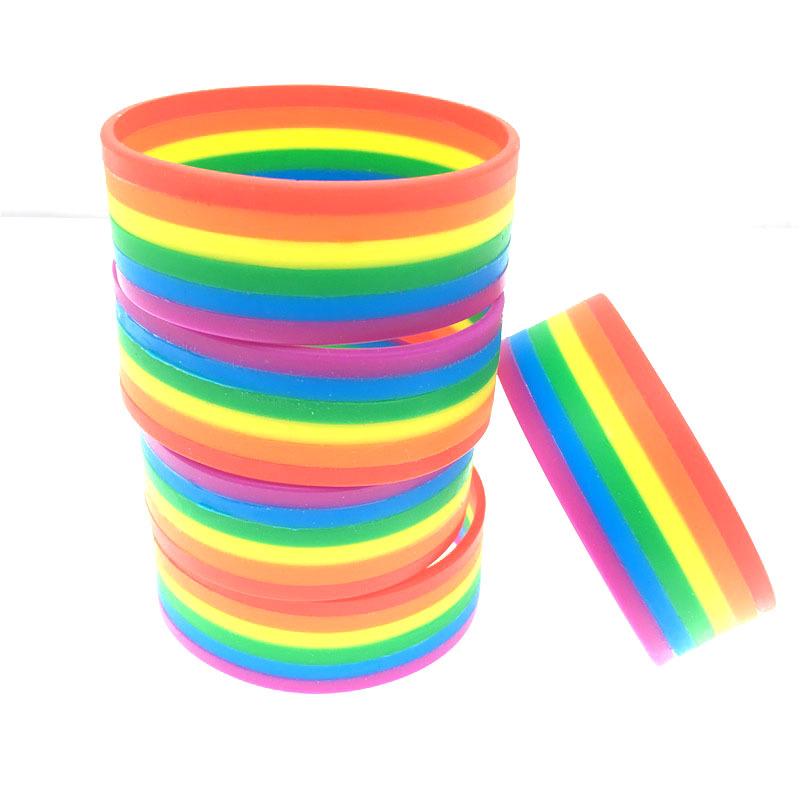 European-American Silicone Rainbow Bracelet: Six-Layer Multicolor Wristband In Red, Orange, Yellow, Green, Blue, and Purple.