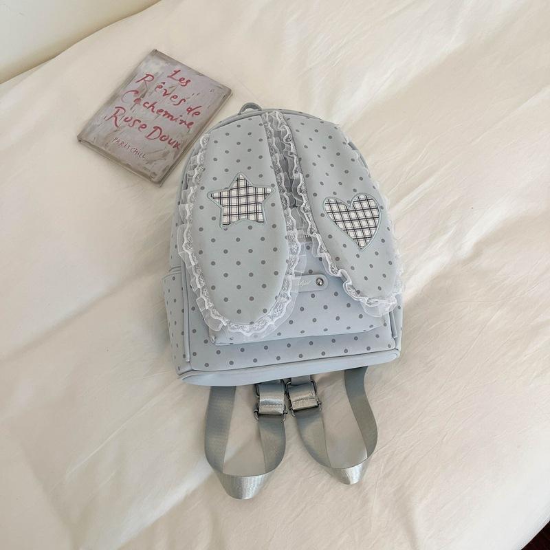 Schoolbag handsome rice family Korean simple foreign style polka dot love rabbit ear backpack 1011 spring new commuter student backpack