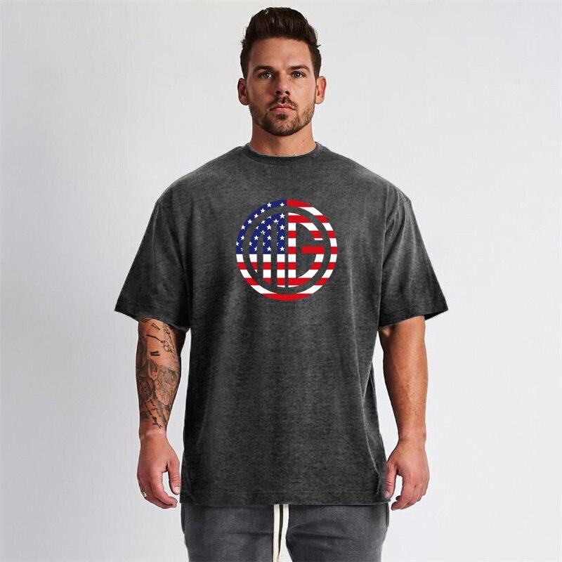 Muscleguys Men's Gym Clothes New Summer Trends Fitness Half Sleeve Loose Sports Short Sleeve T-Shirt Outdoor Running Tops