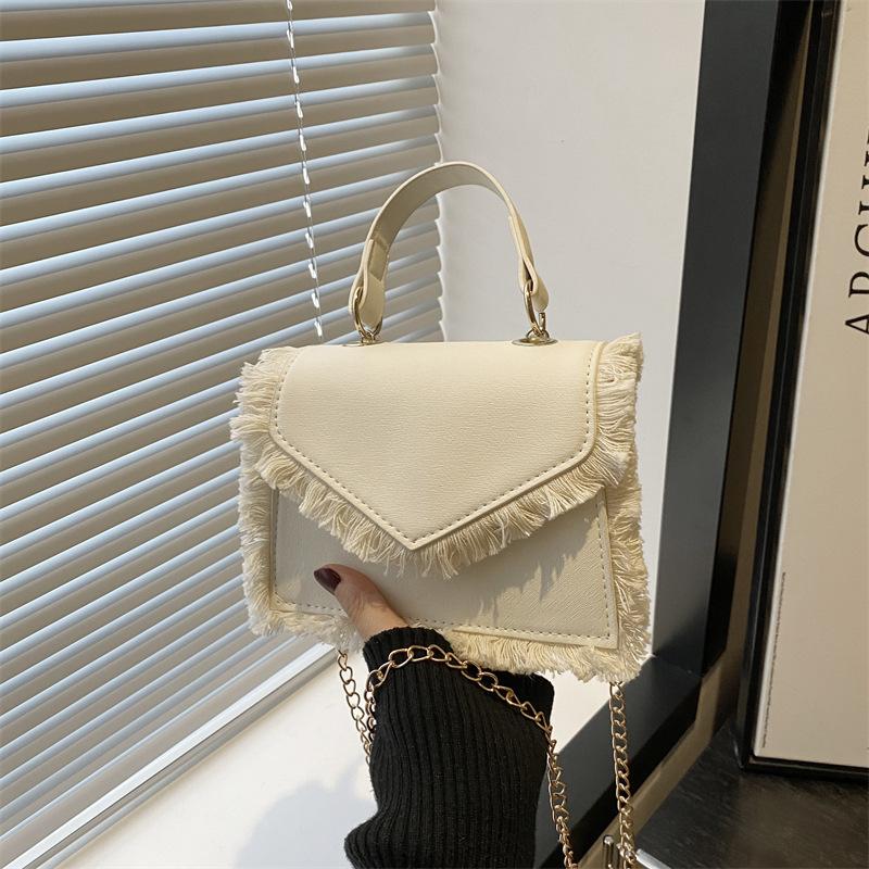 

Casual design sense retro tassel exquisite trend mini solid color portable shoulder messenger bag women s bag белый