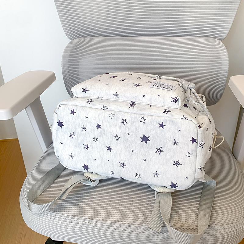 Star-Printed Backpack with Front Zipper Pocket and Tassel Details for School and Daily Use