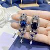 Royal Blue Sapphire Panther Jewelry Set: Includes Emerald Pendant, Blue Diamond Earrings, and Green Diamond Ring.