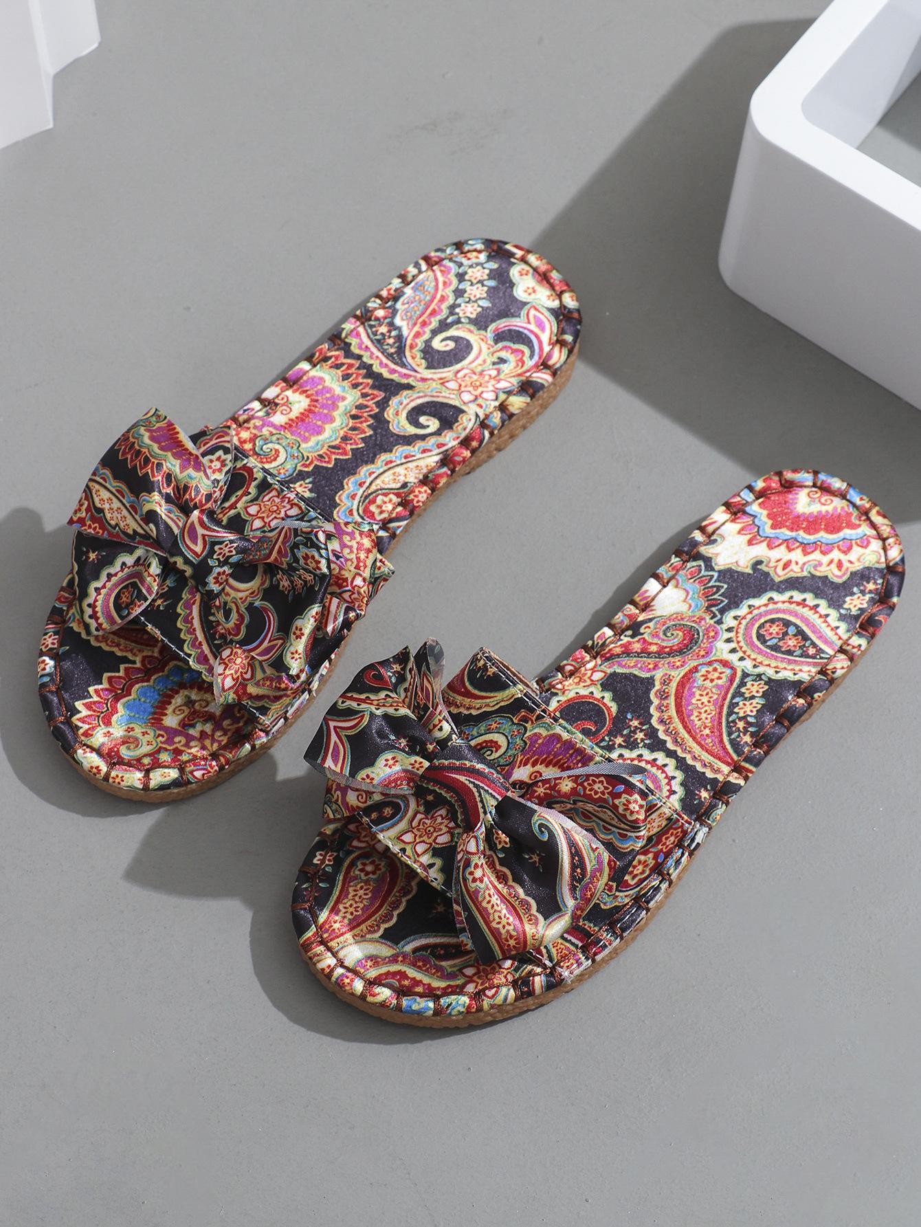 

Foreign trade large size slippers women s 2025 new one-word with bow flat bottom printing beach women s slippers Sandal 43