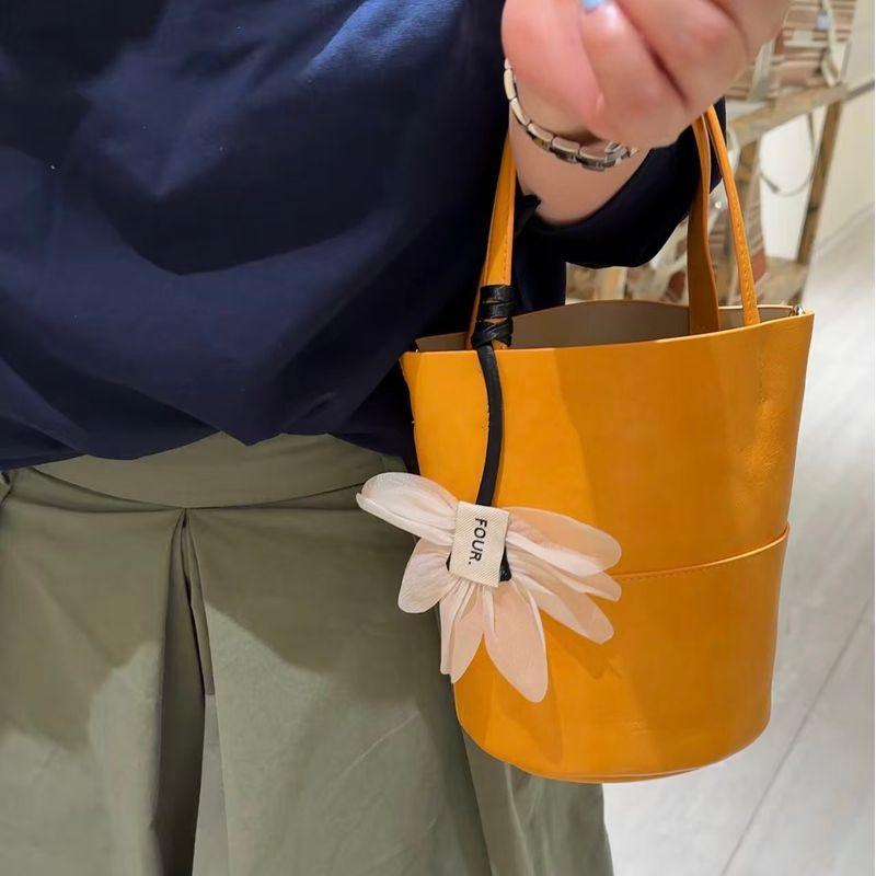 

Kebina Korean Style Niche Design Flower Ornaments Portable Bucket Bag Women 2025 New Soft Leather Shoulder Messenger Bag Yellow delivery pendant plus leather care oil
