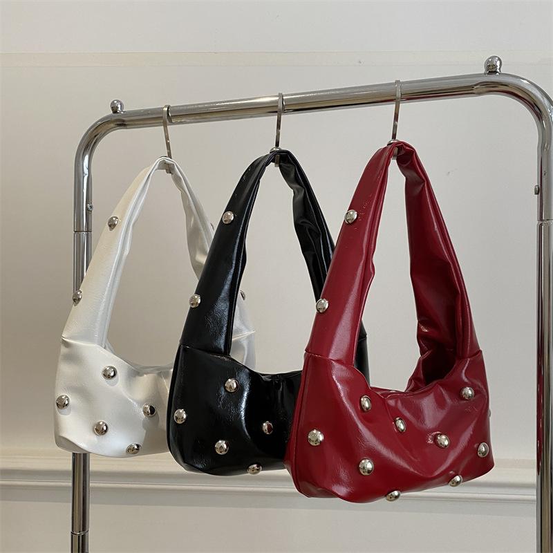 Internet celebrity armpit bag ladies 2025 new Korean version of fashion niche shoulder bag personalized rivets hand carry dumpling bag pu