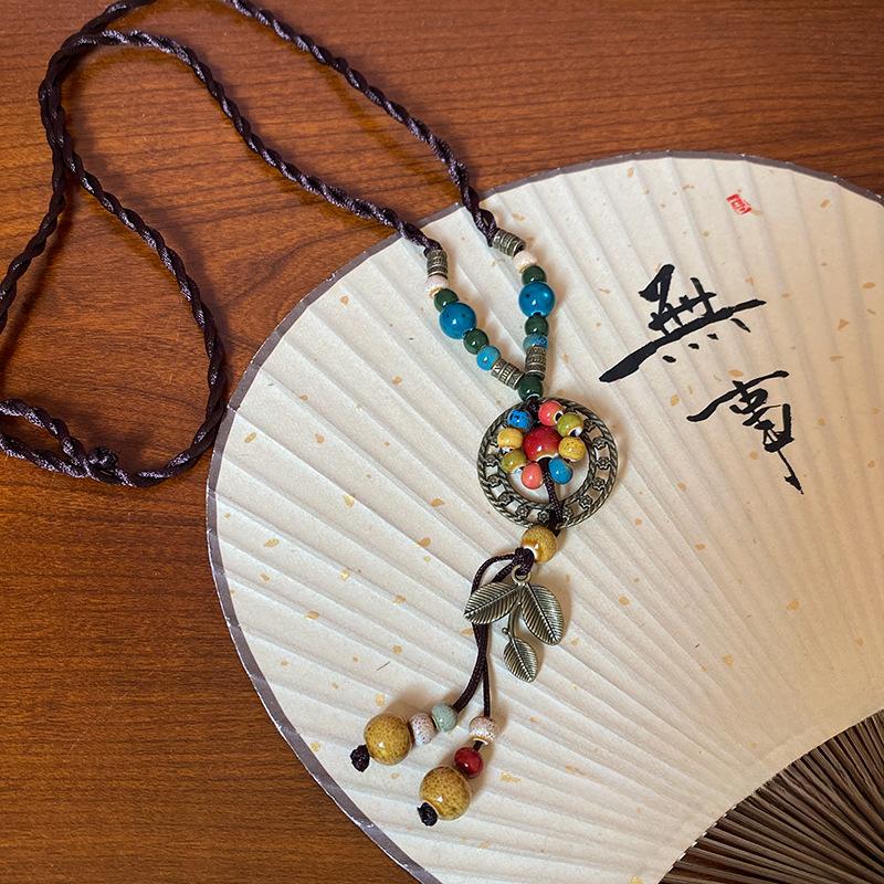 

Керамическое плетеное ожерелье-подвеска в виде листа с бусинами, ретро этнический стиль, нишевая цепочка на ключицу, легкая роскошь, универсальная темпераментная бижутерия