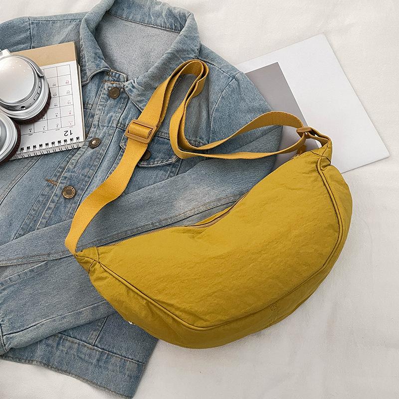 LCAuto parts Grensoverschrijdende Japanse nylon dumpling tas 2026 herfst en winter nieuwe casual schoudertas forensische veelzijdige tas schoudertas dames geel