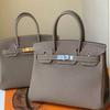 Leather Handbag With Silver Lock For Elegant Women Day Use