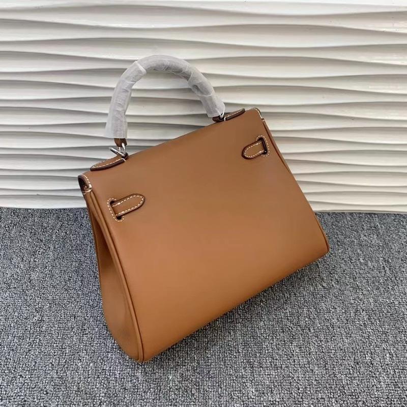 Neue Leder Kelly Tasche Swift Leder breiter Schultergurt atmosphärische Handtasche silberne Schnalle weiches Leder Mode einfache Umhängetasche