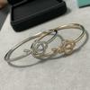 Stainless Steel V-Gold Plated Key Charm Knot Bracelet With Full Rhinestone Embellishment Handcrafted Hollow Design Women