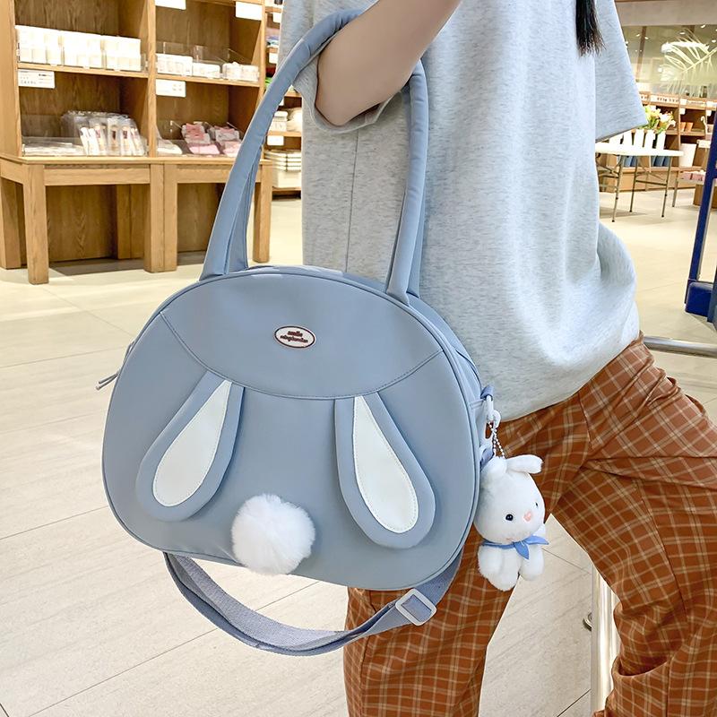 Tasche neue Umhängetasche Schultertasche koreanische Version Puppenanhänger niedliches Kaninchen Plüschtasche Canvas große Kapazität Handheld Tide