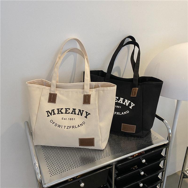 New large-capacity canvas handbag women's 2025 autumn fashion printed letter tote bag casual simple bag