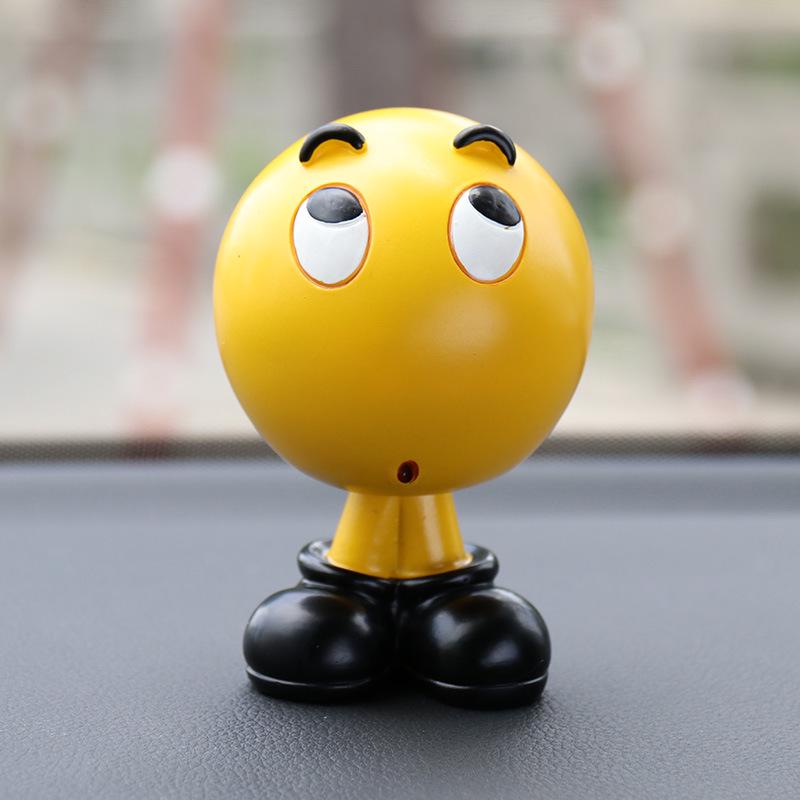 Ha Hu Emoji Bobblehead Car Ornament: Cute Cartoon Interior Decoration.