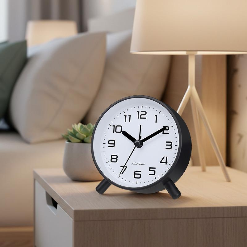 Simple modern alarm clock, creative pastoral large character silent round square bedside clock, student and children's alarm clock, metal table