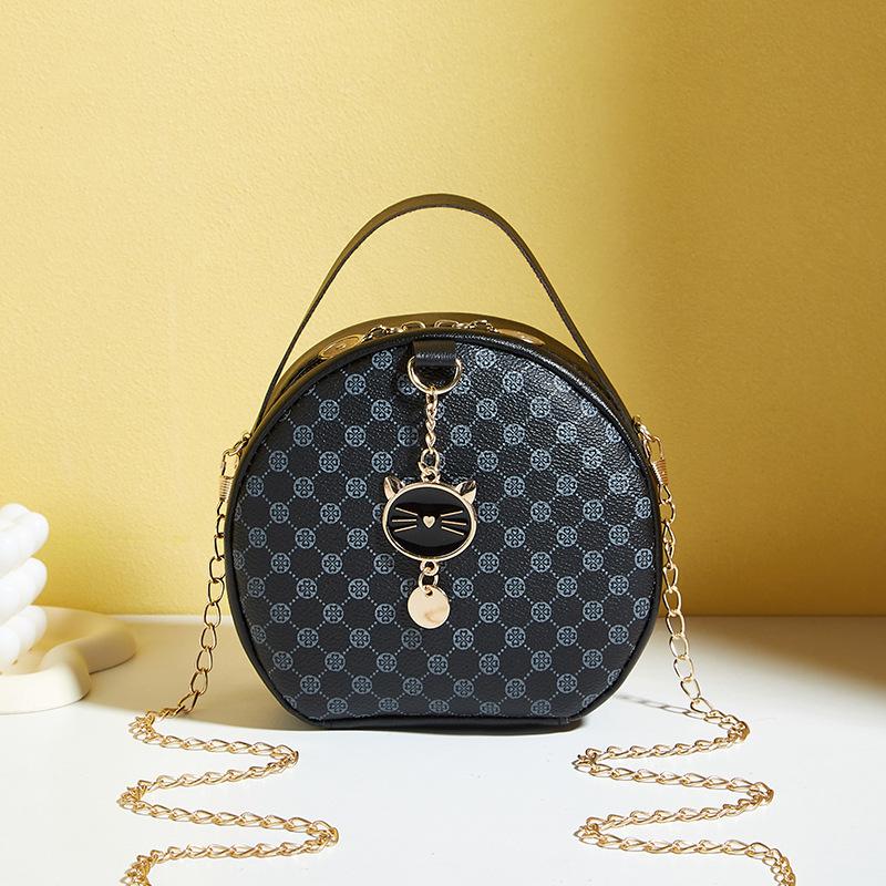 

Жіноча модна чорна кругла сумка через плече з золотими акцентами та прикрасами - Компактний гаманець для мобільного телефону зі штучної шкіри, підходить для щоденного використання чорний