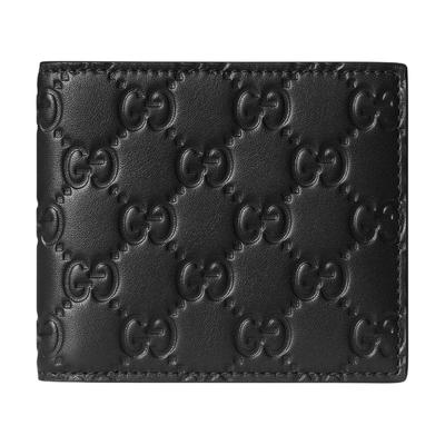 Portafoglio GG Emblem con motivo GG goffrato, bifold, in pelle di mucca, da uomo, nero