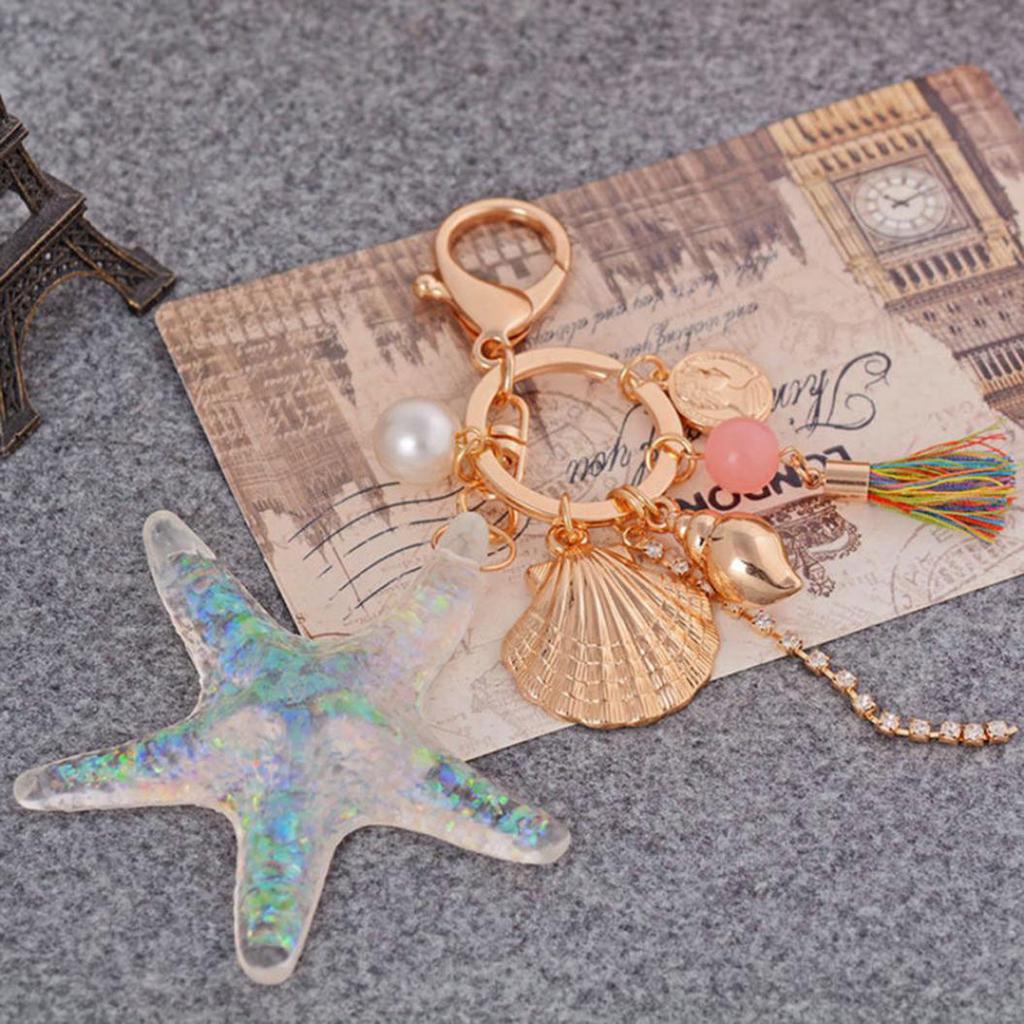 Söt sjöstjärna snäcka vinkelsnäcka tofs hänge nyckelring kvinnor nyckelring