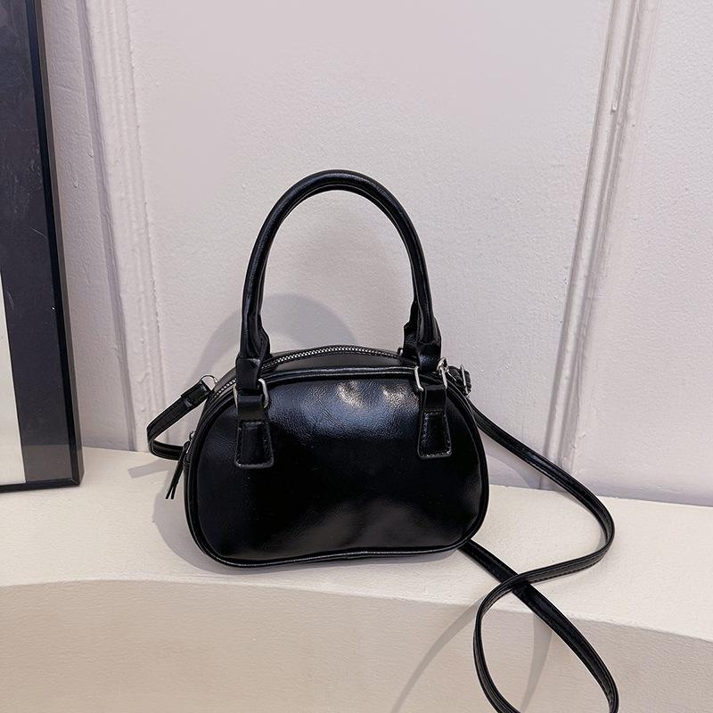 Neue Nischendesign modische Textur Handtasche Bowlingtasche Damen vielseitige Schulter Umhängetasche