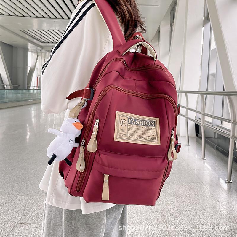 Schoolbag student schoolbag junior high school campus large capacity backpack wholesale simple multi-layer leisure travel computer bag