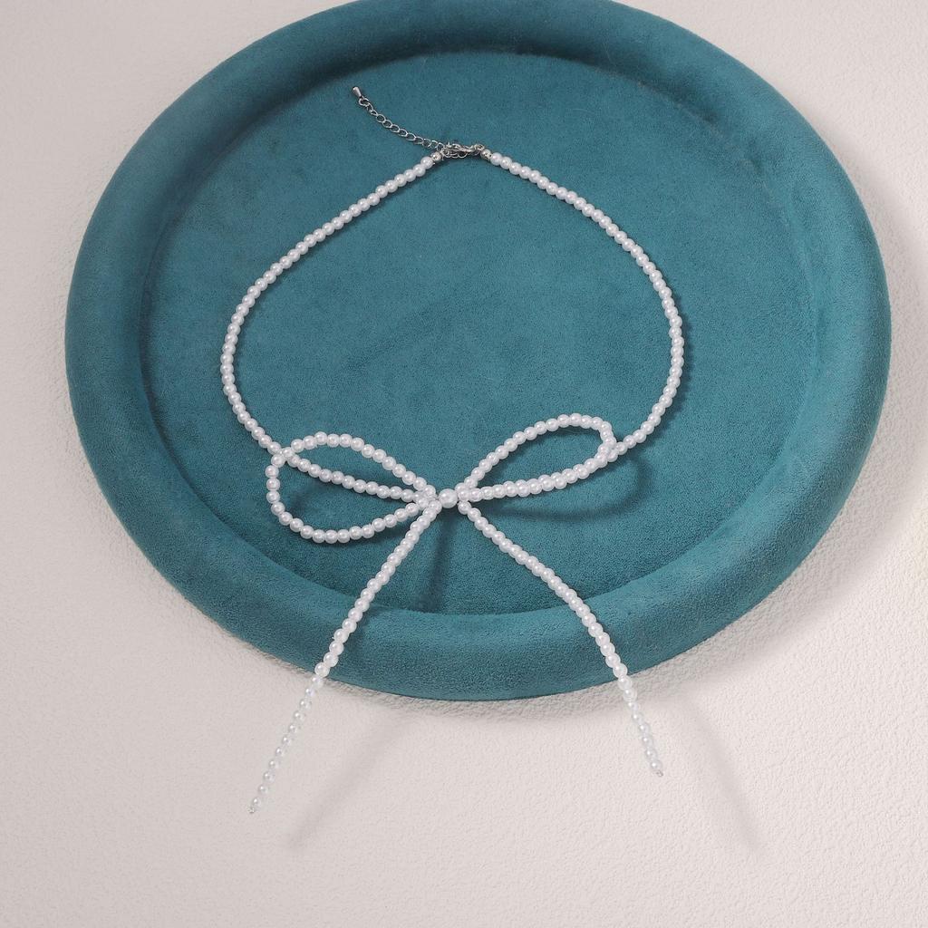 Korean version of simple niche imitation pearl fugitive princess bow necklace clean super fairy ballet style collarbone chain