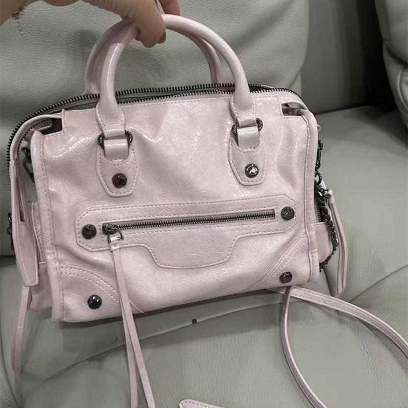 

Edgy Chic Pink Biker Bag Brand-inspired Vintage Zippered Crossbody Bag Studchain Accents Multiple Pockets Tassel Details Handbag розовый
