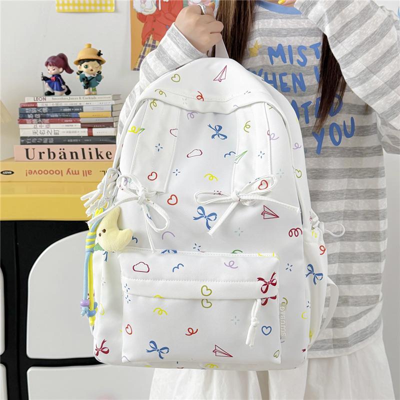 Cute Bow Tie Print School Backpack Lightweight Nylon Zipper Daypack with Front Pocket for Teen Girls Daily Travel