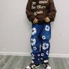 EastRogue High Street Hip Hop Streetwear Loose Fit Men's and Women's Denim Jeans with Washed Effect and Full Print of Hibiscus Flowers.