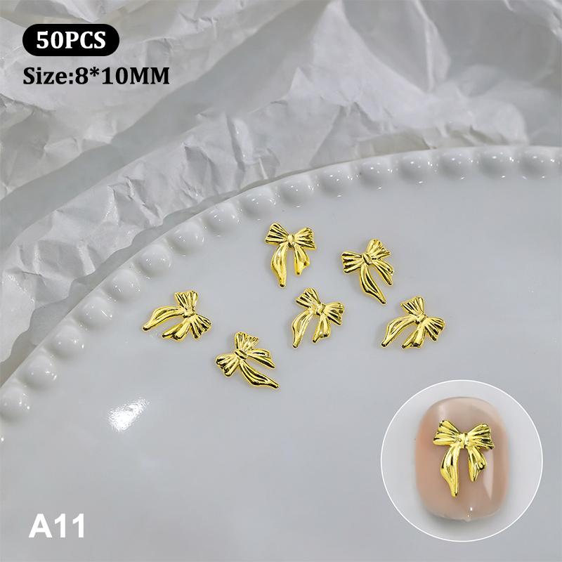 50 st Metalllegering Rosett Naglar Konst Dekoration Silver Guld Nagelberlocker DIY Manikyr Design Smyckestillbehör Verktyg