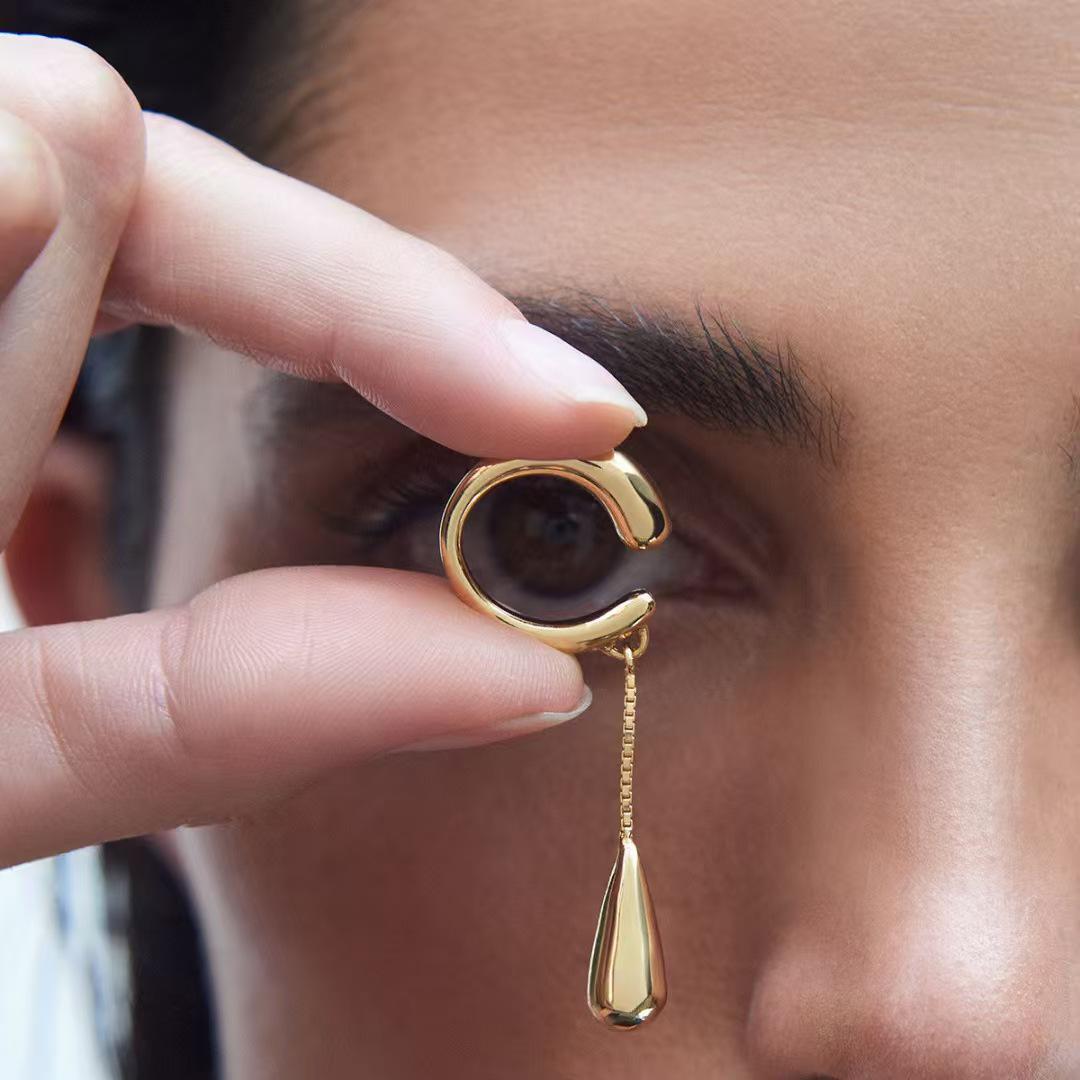 Минималистичный кафф-серьга в виде капли с кисточкой - Модный уникальный стиль