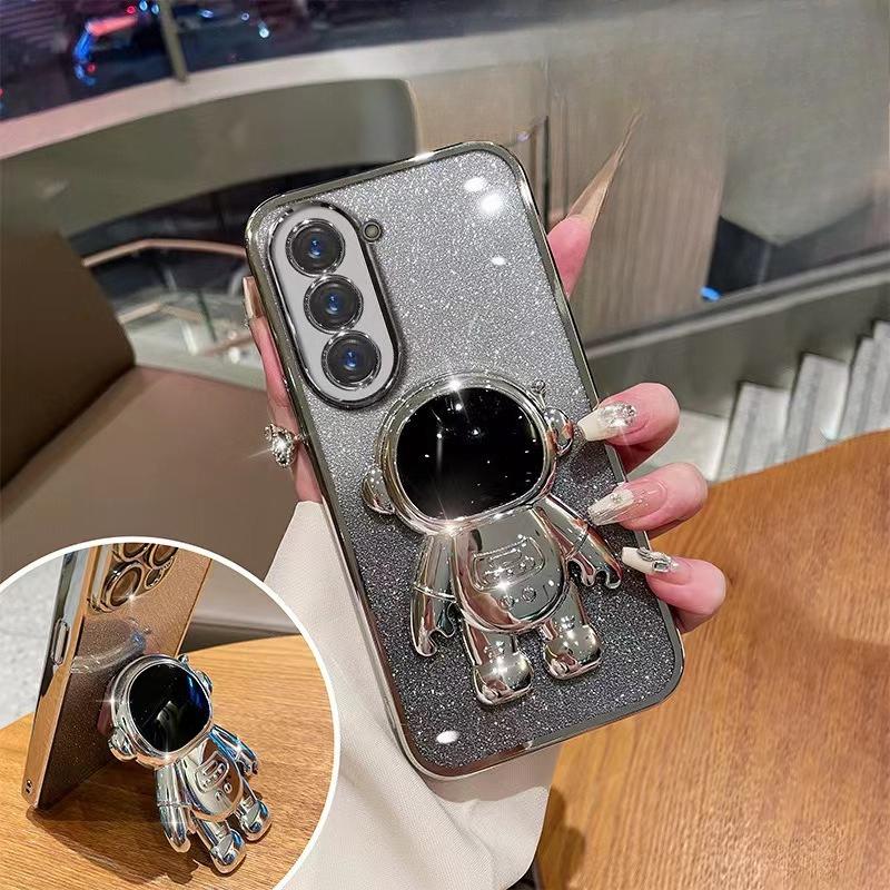 Astronaut Stand Suitable for Samsung S24ultra Mobile Phone Case S23Plus Gradient Flash Powder S22 Astronaut