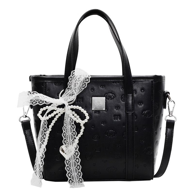 Spring and summer popular niche sweet and cute embossed portable bucket bag Korean version commuter casual versatile messenger bag bag woman