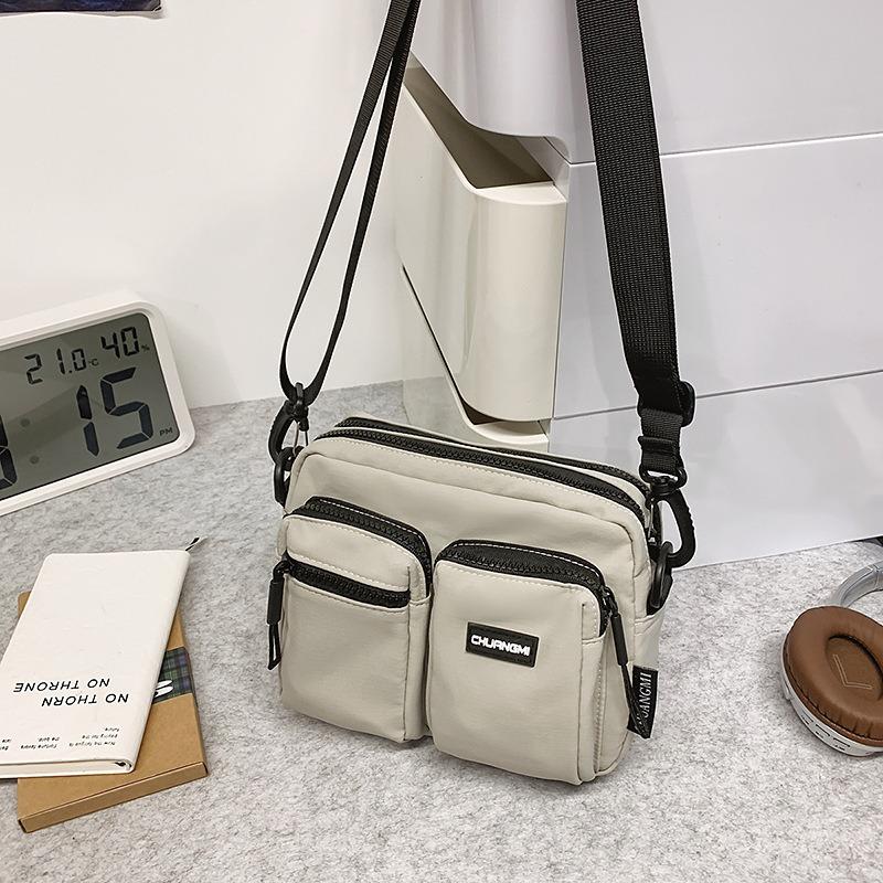 Outdoor leisure multi-pocket canvas messenger bag women's and men's simple travel nylon single shoulder small square bag