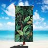 A Beach Towel Decorated with a Tropical Leaf Pattern, Suitable for the Beach, Pool, Bathroom, Camping Trips, and Yoga Workouts.