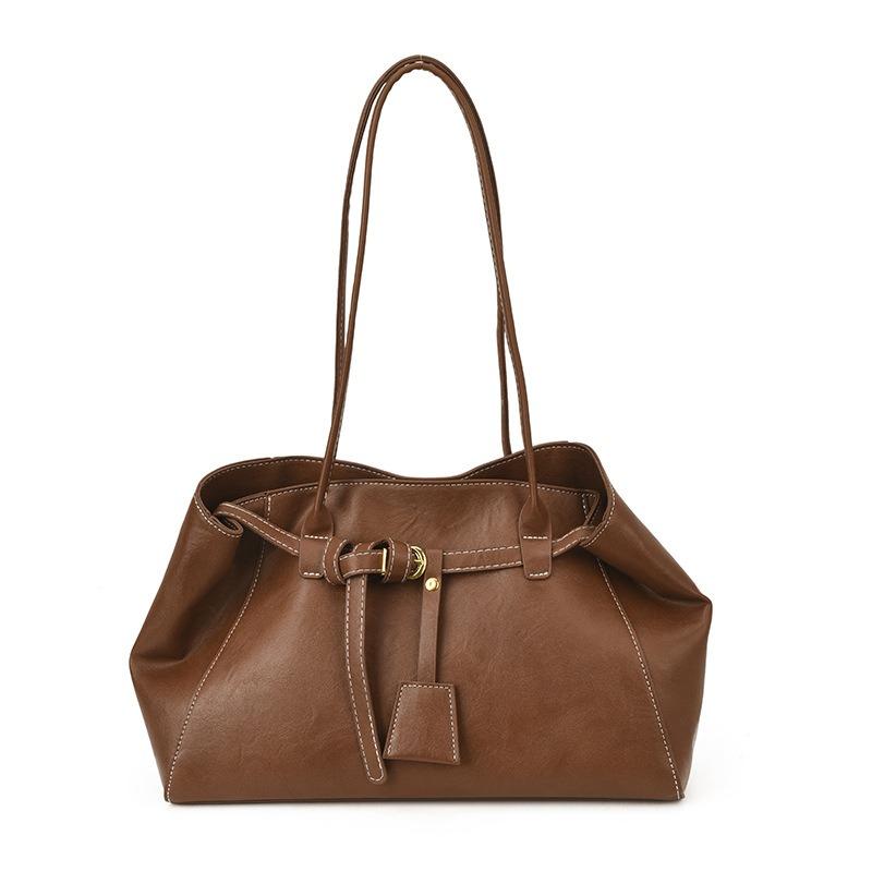 Diese Ein-Schulter-Tasche zeichnet sich durch ein Nischendesign, eine Retro- und lässige Tragetasche und eine einfache Achseltasche für den Weg zur Arbeit aus.